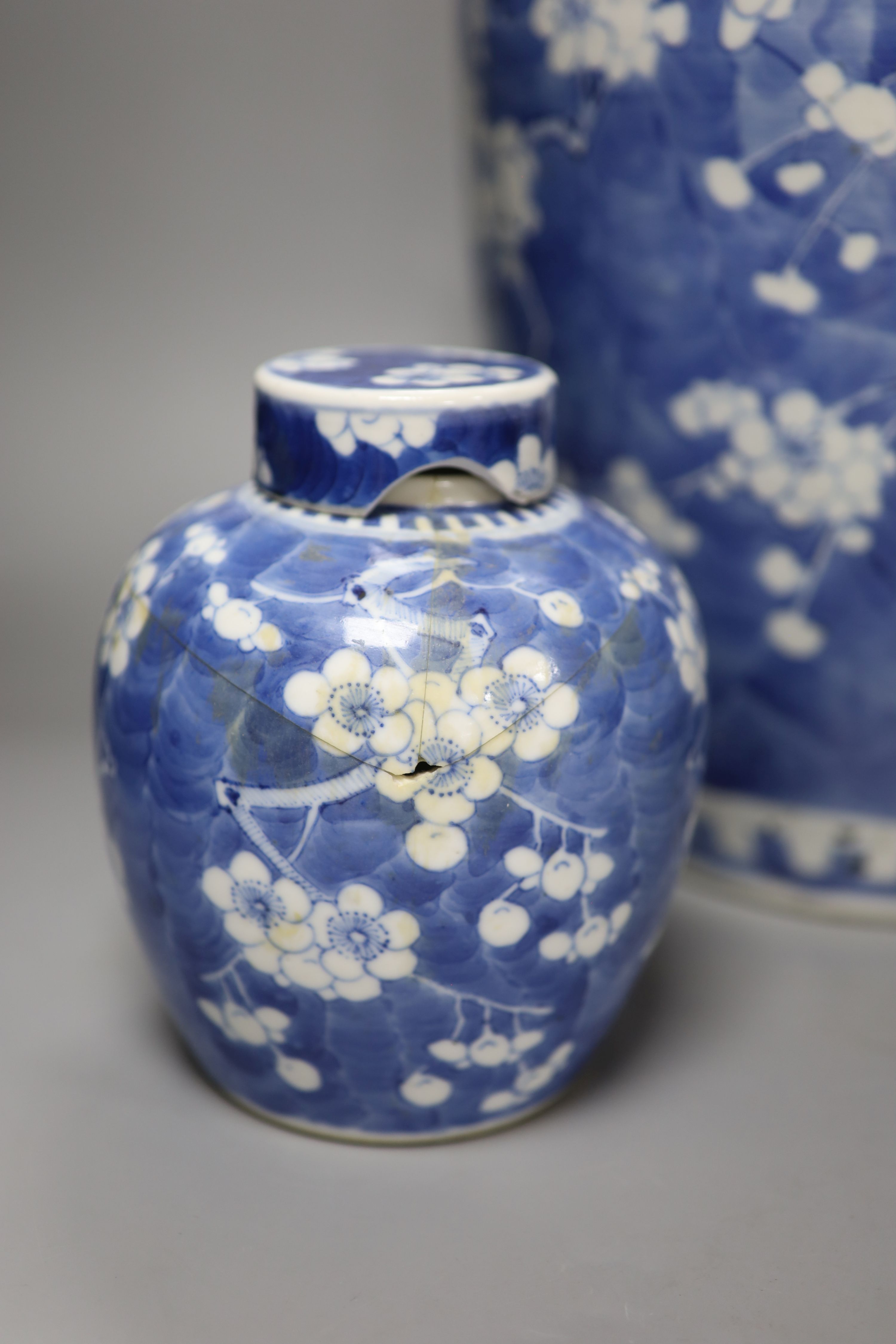 A tall 19th century Chinese blue and white lidded vase and a pair of lidded ginger jars, tallest 45cm